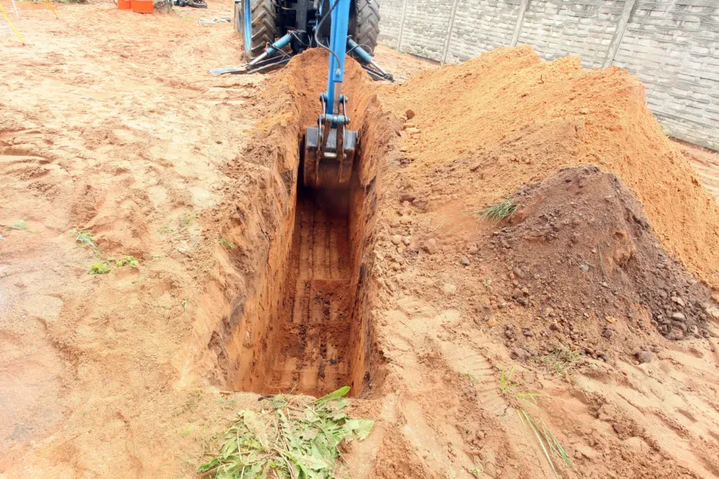 Excavator digging trench for groundwork in Kent