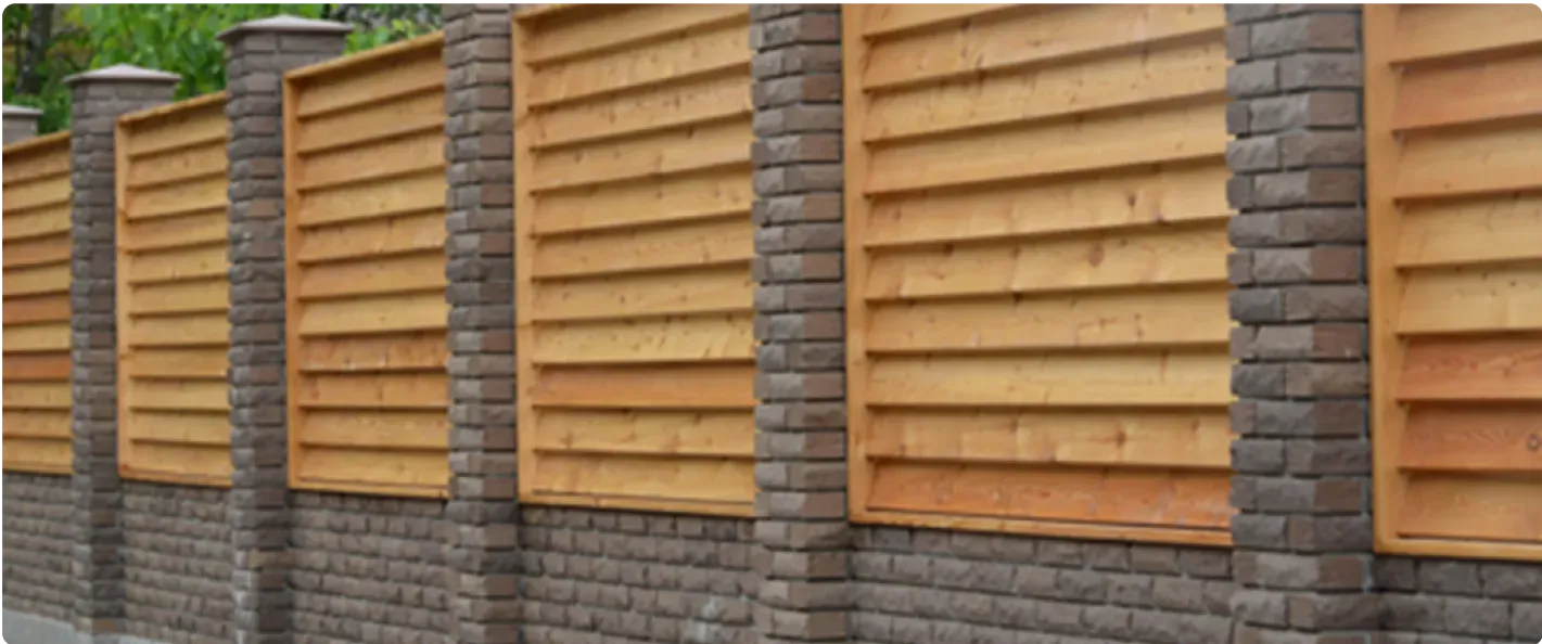 Bespoke brick wall and timber fencing installation by Kent Paving & Resin LTD.